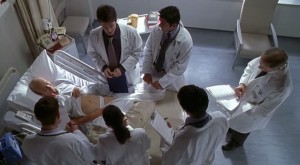 A still from the Grand Rounds scene in which Dr. Bearing's body is used as a text. Photo Credit: HBO Films 2001